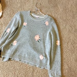 Gray and floral light sweater.